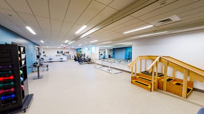 Interior view of a therapy room with exercise equipment