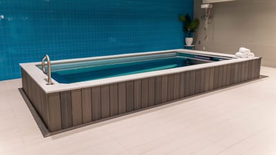 Indoor swimming spa with towels nearby