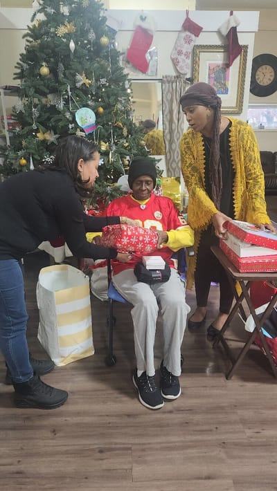 Residents enjoying gift exchange during a celebration