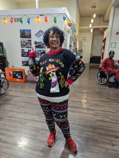 Resident dressed in festive attire in a common area