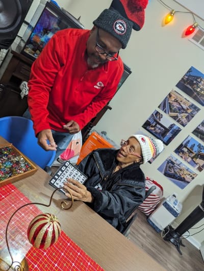 Residents participating in a bingo game in a common area