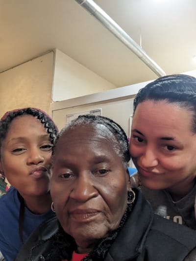 Residents and staff members posing for a photo