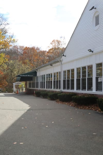 Exterior view of Orchard House in autumn