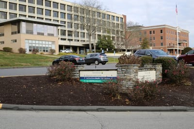 Entrance sign and exterior view of the healthcare center