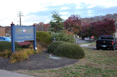Exterior view of Apple Rehab Laurel Woods entrance sign