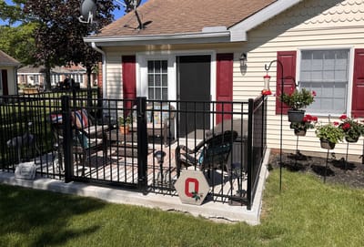 Outdoor patio area with seating and flowerpots