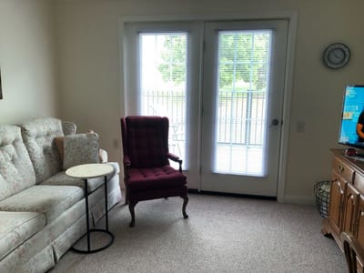 Cozy interior sitting area with furniture and light.