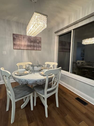 Dining table set for a meal in a bright room