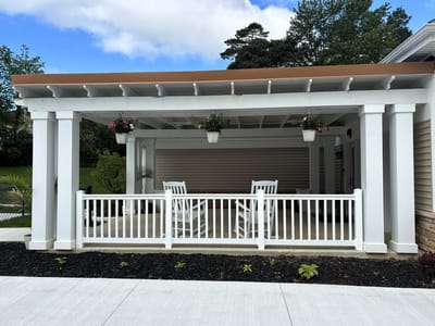 Outdoor covered seating area with plants
