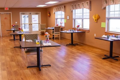 Dining area with tables and floral centerpieces
