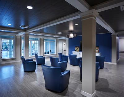 Interior common area with blue chairs and modern decor