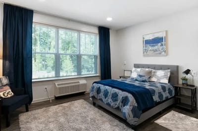 Cozy resident room with a bed and natural light