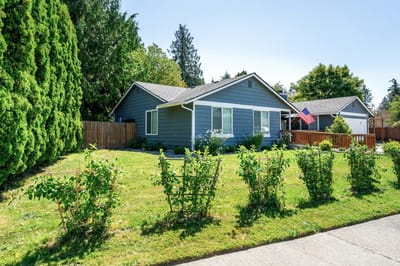 Exterior view of a single-story home with landscaping