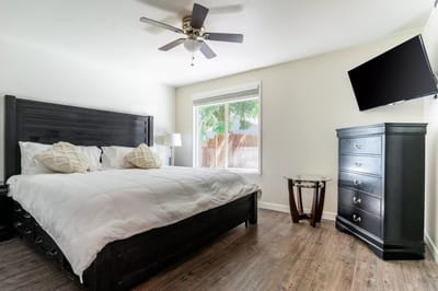 Modern bedroom with a bed and television