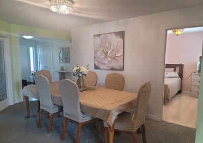 Dining room with a decorated table and floral centerpiece