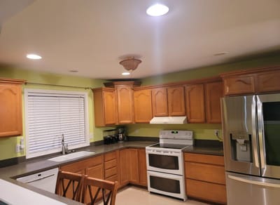 Modern kitchen with wooden cabinets and appliances