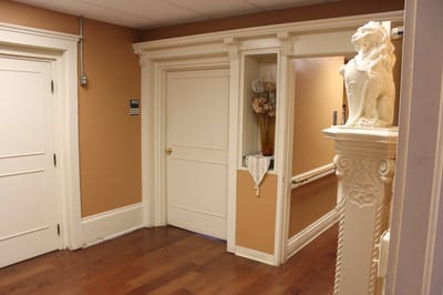 Hallway with doors and decorative lion statue