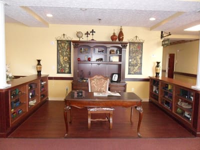 Interior view of a reception area with wooden furniture