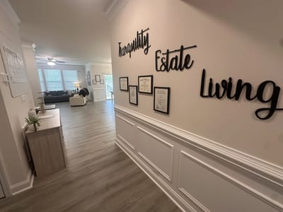 Interior hallway with 'Tranquility Estate Living' signage