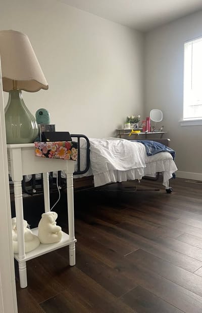 Cozy resident room with a bed and lamp