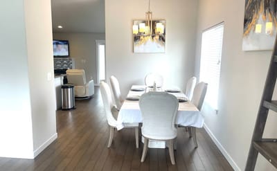 Bright dining area with a table set for meals