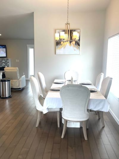 Bright dining area with elegant chairs and table setup