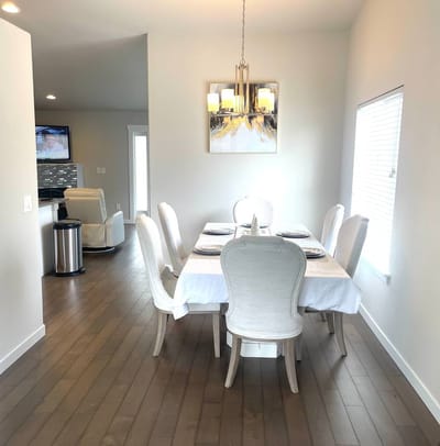 A bright and inviting dining area with a table set for meals