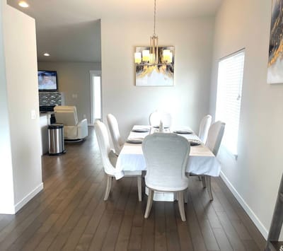 A bright dining room set up for a meal