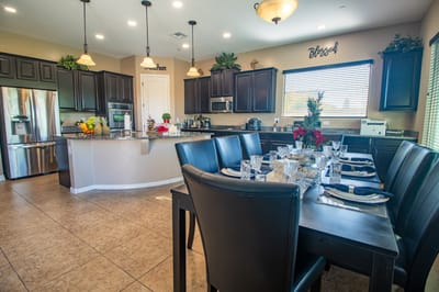 Interior dining area with a large table set for a meal