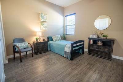 Cozy resident room with a bed and desk