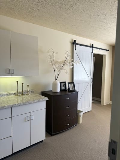 Interior view of a resident room with decor and furniture