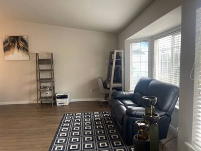 Bright interior space with a couch and bookshelf