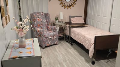 Cozy bedroom with a floral chair and bed