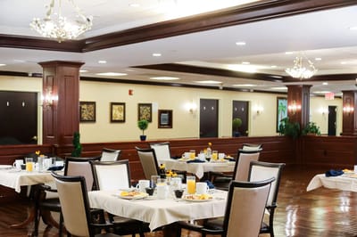Dining area with tables set for breakfast