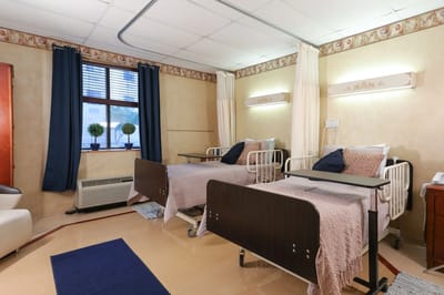 Well-appointed resident room with two beds