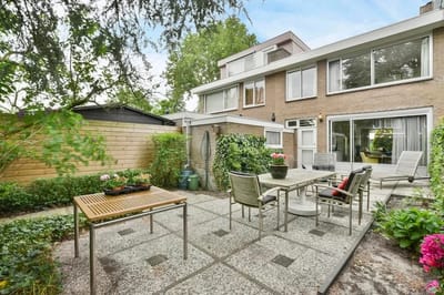 Outdoor patio area with seating and garden