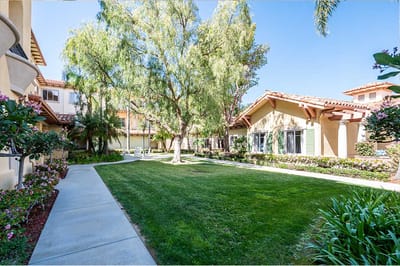 A landscaped outdoor area with pathways and greenery