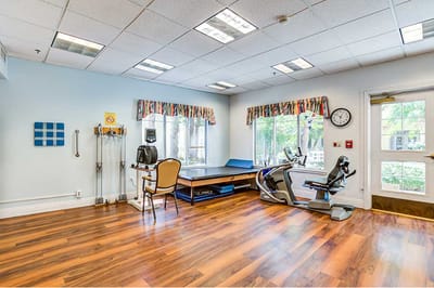 Interior view of a therapy room with exercise equipment