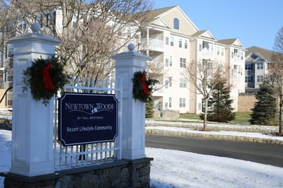 Exterior view of Newtown Woods facility with holiday decor