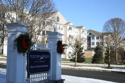 Exterior view of Newtown Woods facility entrance in winter