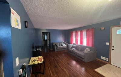 Cozy lounge area with sofas and bright curtains