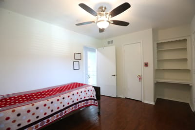 Bright resident room with a bed and window