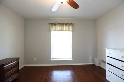 Bright private room with wooden furniture