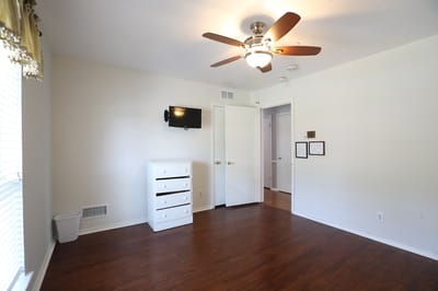View of an interior resident room with a ceiling fan