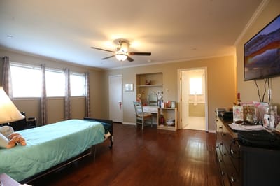 Cozy resident room with a bed and desk