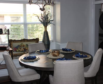 Dining room with a round table set for a meal