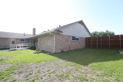Exterior view of a facility building with a yard