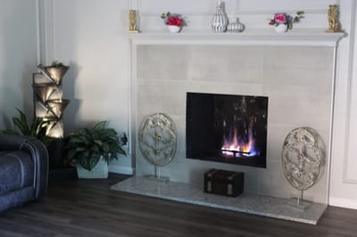 Cozy interior with a decorative fireplace and plants