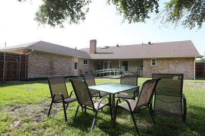 Outdoor seating area with chairs and a table