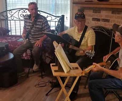 Residents enjoying a music jam session in a common area